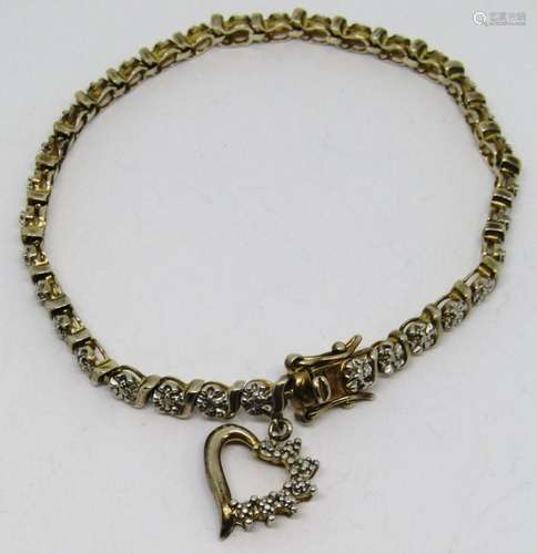 7 INCH GOLD TONED STERLING TENNIS BRACELET WITH