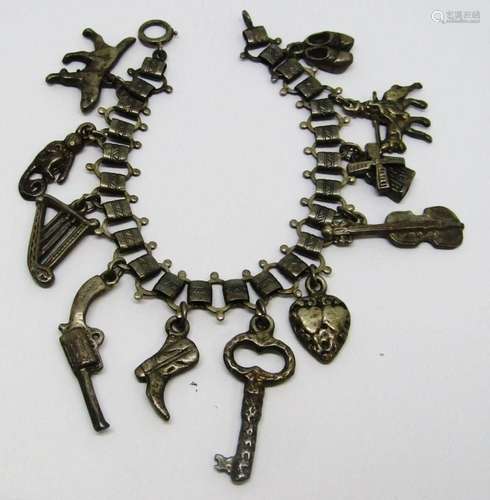 VINTAGE STERLING CHARM BRACELET LOADED WITH