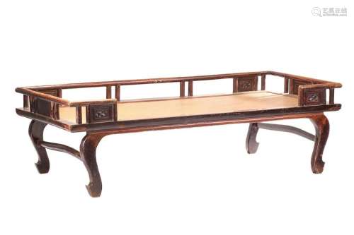 A 19th-century Chinese elmwood opium bed with an open galler...