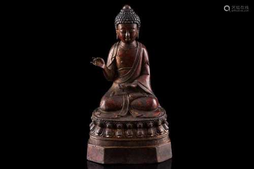 A Chinese bronze figure of Buddha, seated in Abhaya mudra, t...