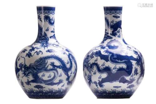 A pair of large Chinese blue and white porcelain bottle vase...