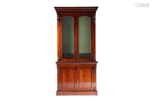 A Victorian figured mahogany collectors cabinet bookcase. Th...