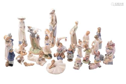 A large collection of Lladro and Nao figurines, the majority...