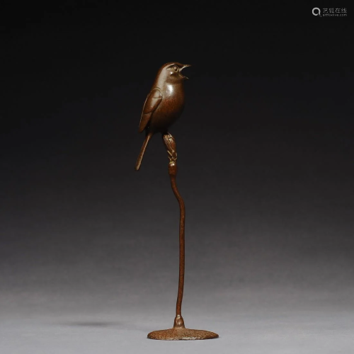 A bronze bird sculpture