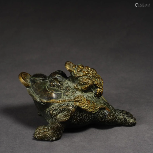 A bronze golden toad sculpture