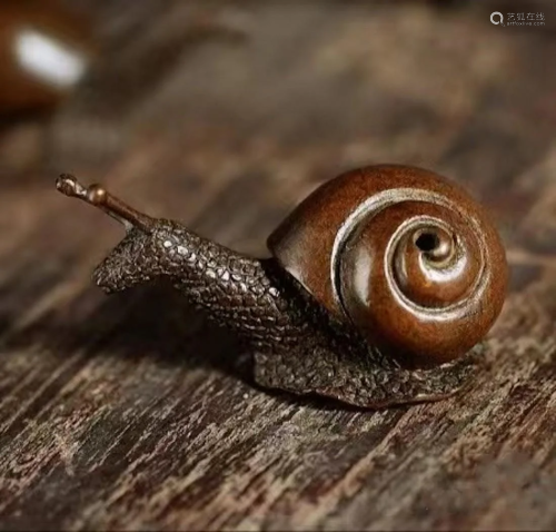 A cute Japanese bronze snail sculpture