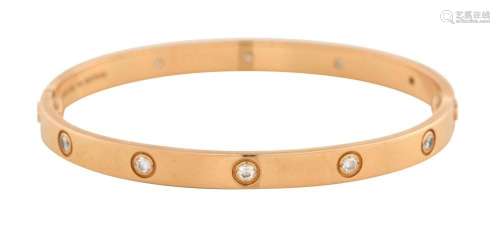 CARTIER, 18CT ROSE GOLD AND DIAMOND  LOVE  BANGLE