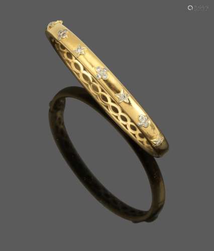 Bracelet jonc ouvrant En or jaune 18k (750) serti de sept mo...