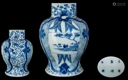 A 19th Century Chinese Blue and White Baluster Vase. Two Shi...