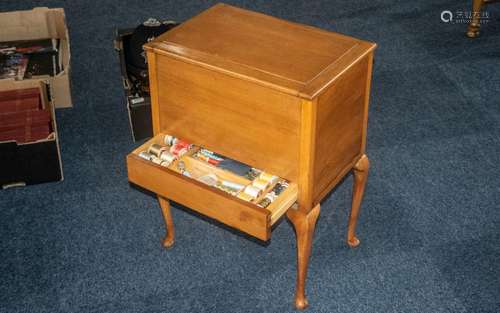 Teak Sewing Table, raised on four turned legs, with a lift u...