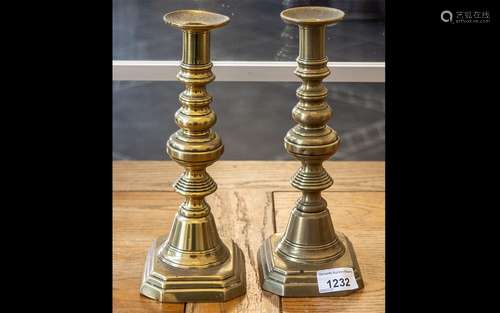 Pair of Brass Candlesticks, raised on stepped base, measure ...