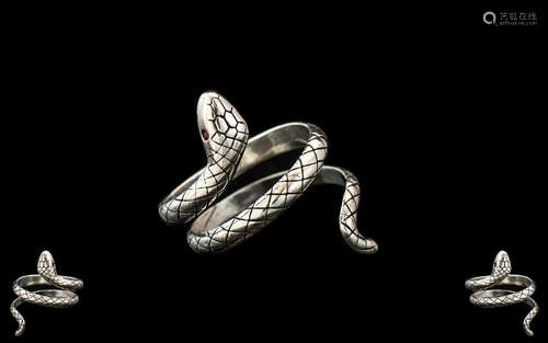 A Sterling Silver Ring in the form of a Snake, set with ruby...