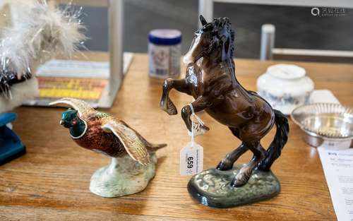 Two Beswick Figures, comprising a rearing horse figure No. 1...