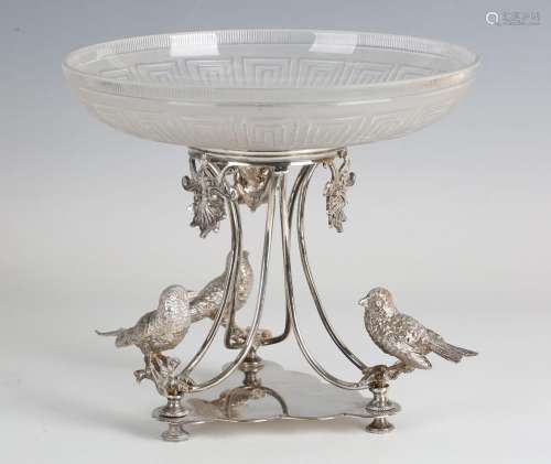 A late Victorian plated and glass table centrepiece, the sha...