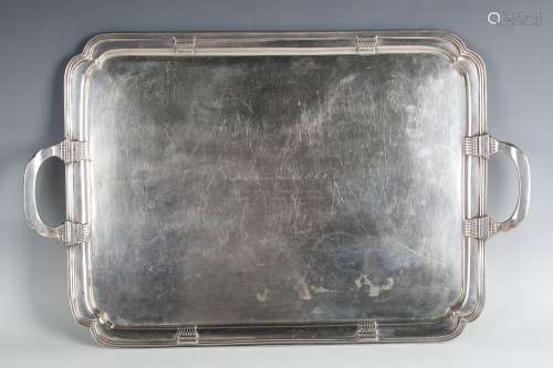 A George V silver rectangular two-handled tea tray with curv...