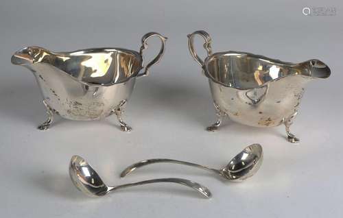 A pair of George VI silver sauce boats, each with shaped rim...