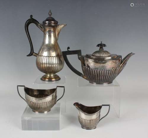 A late Victorian silver three-piece tea set of oval half-ree...