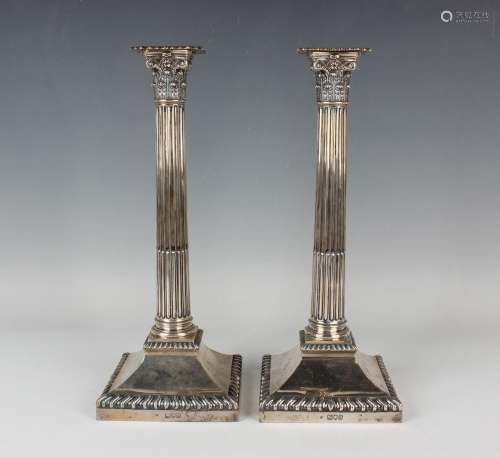 A pair of late Victorian silver Corinthian column candlestic...