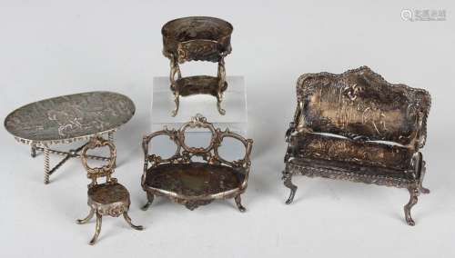 An Edwardian silver toy salon settee, embossed with figures ...