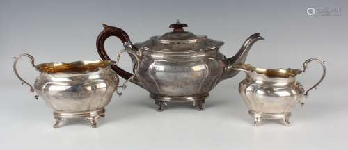 A late Victorian silver three-piece tea set of oval lobed fo...