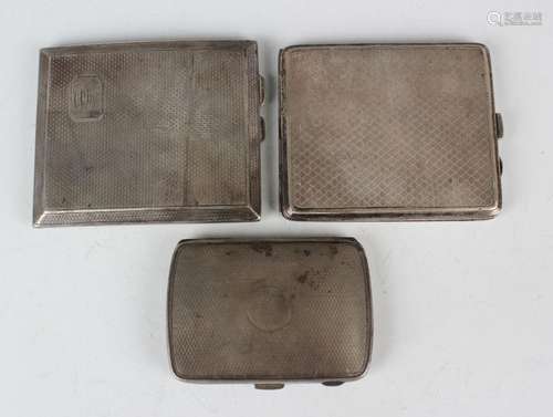 Three George V silver engine turned rectangular cigarette ca...