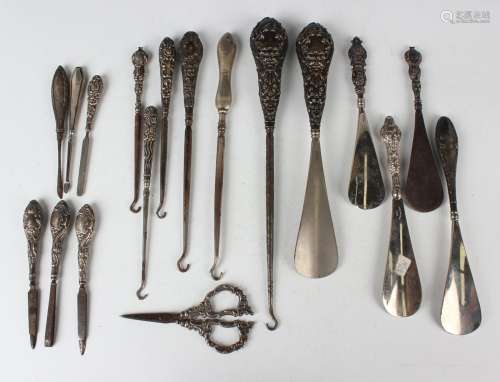 A pair of Edwardian silver handled dressing implements, comp...