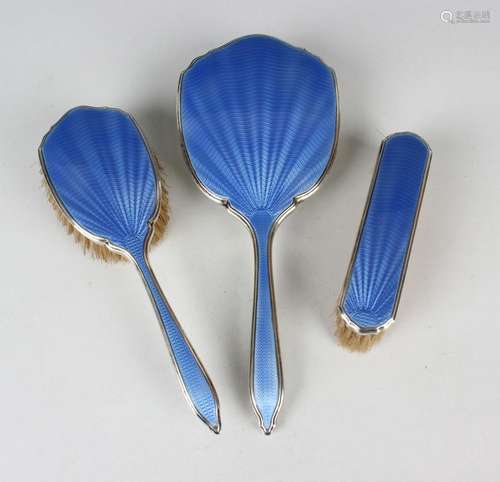 A George V silver and blue enamelled three-piece dressing ta...