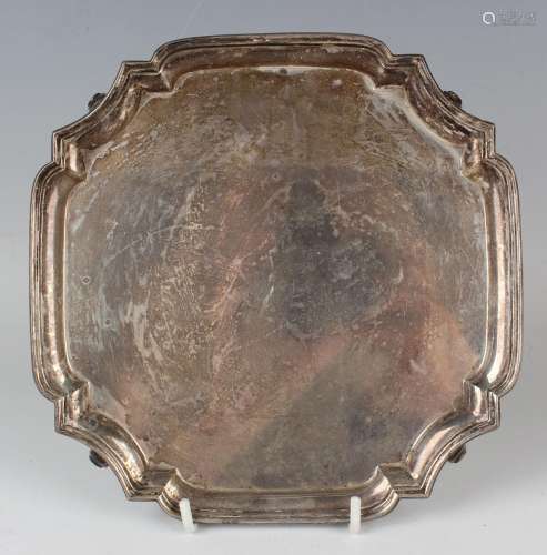 A George VI silver square card salver with shaped corners, o...