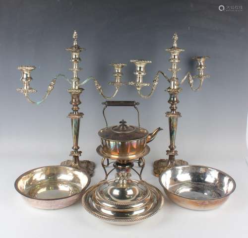 A group of plated items, including a pair of three-light two...