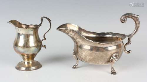 A George II silver sauce boat with reeded flying scroll hand...