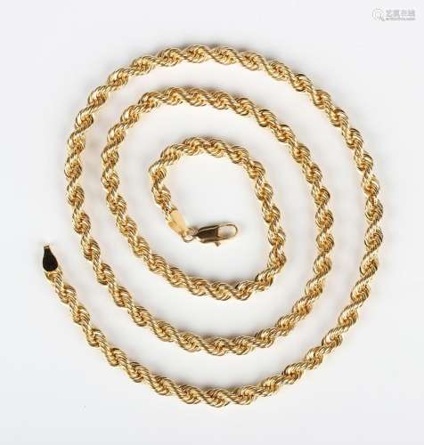 A gold ropetwist link neckchain on a sprung hook shaped clas...