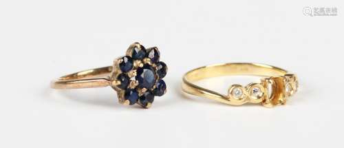 An 18ct gold and diamond ring, collet set with four circular...