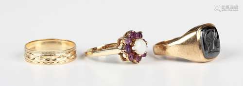 A 9ct gold, opal and amethyst cluster ring, London 1979, rin...