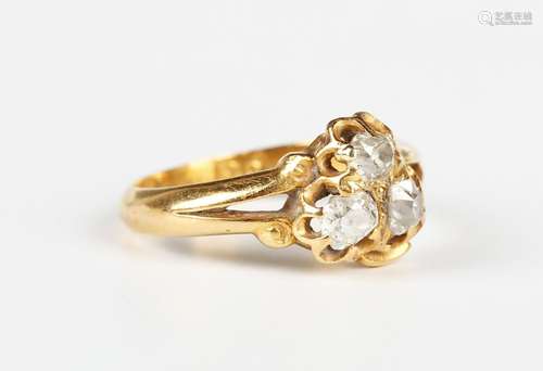 A gold and diamond three stone ring, mounted with cushion cu...