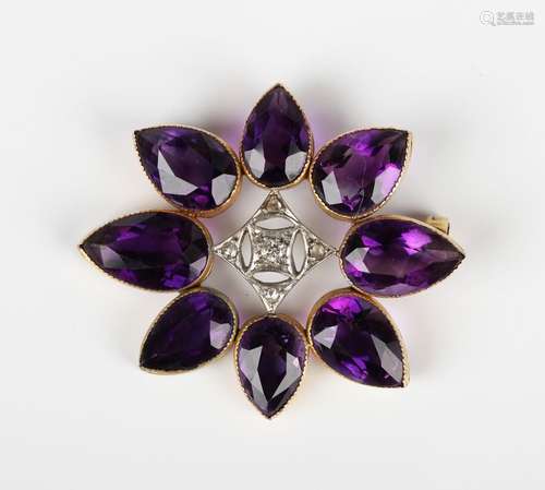 A gold, amethyst and diamond brooch, designed as an openwork...