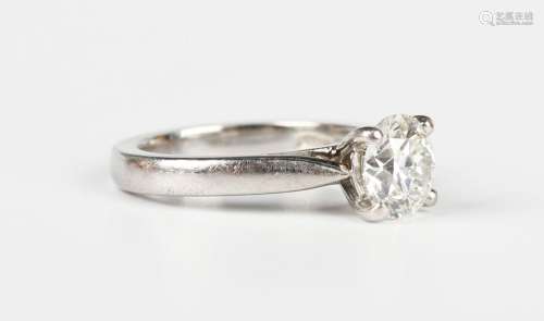A platinum and diamond single stone ring, claw set with a ci...