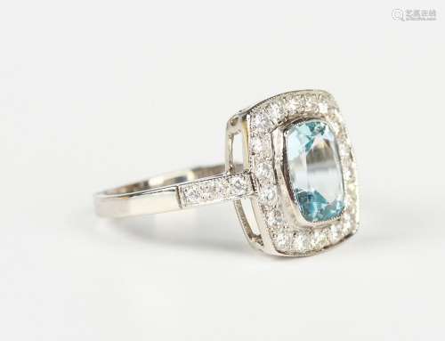 A platinum, aquamarine and diamond cluster ring, collet set ...