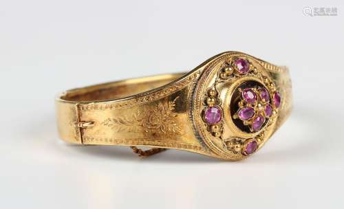 A gold and ruby oval hinged bangle, last quarter of the 19th...