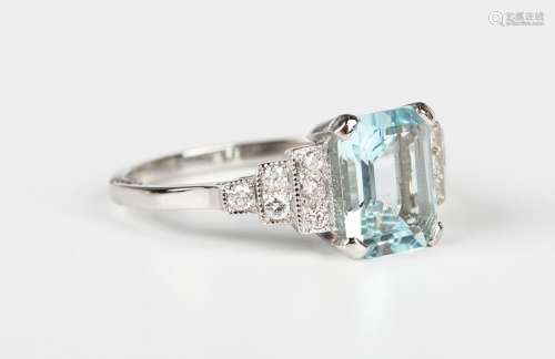A platinum, aquamarine and diamond ring, claw set with the c...