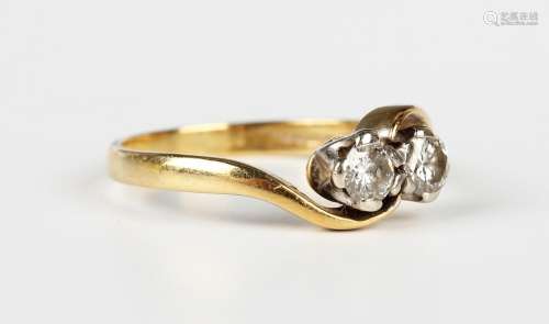 An 18ct gold and diamond two stone ring, claw set with circu...