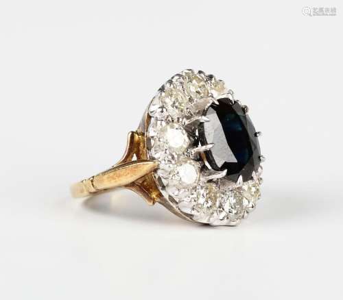 An 18ct gold, sapphire and diamond oval cluster ring, claw s...