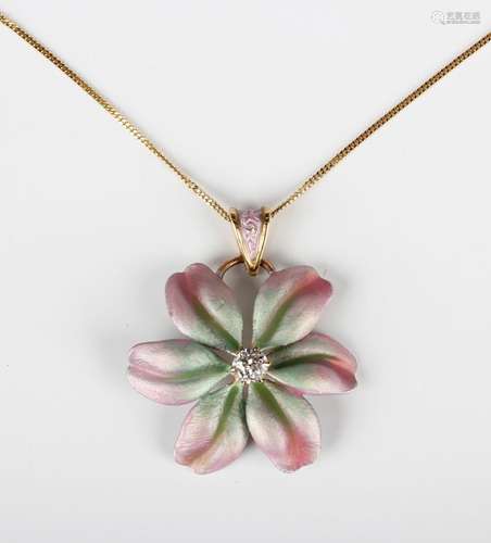 A gold, diamond and pastel shaded enamelled pendant in a flo...