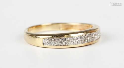 A gold and diamond ring, mounted with two rows of princess c...