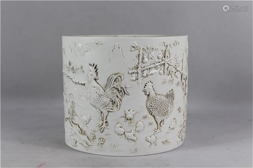 A Chinese White Glazed Carved Porcelain Brush Pot