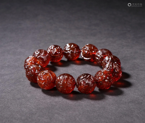 A Chinese Carved Amber Prayers Beads