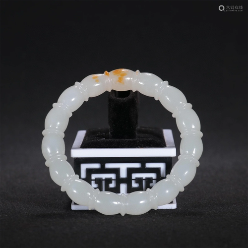 A Chinese Carved Jade Bangle