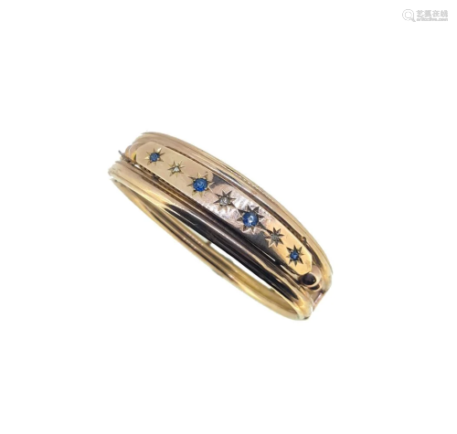 A late Victorian sapphire and diamond bangle,