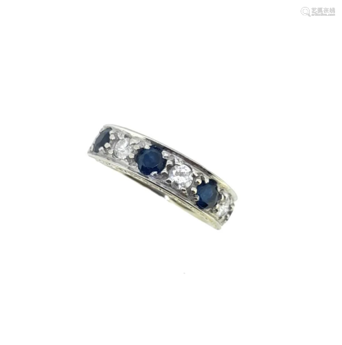 A late 20th century 18ct gold sapphire and diamond half hoop...