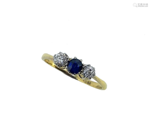 A sapphire and diamond three stone ring,