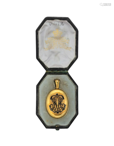 An enamelled memorial locket,